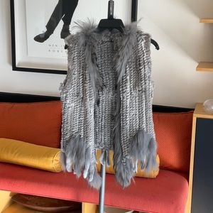 Gray fur vest by dolce Cabo. Real fur 80% rabbit for 20% raccoon fur size small.